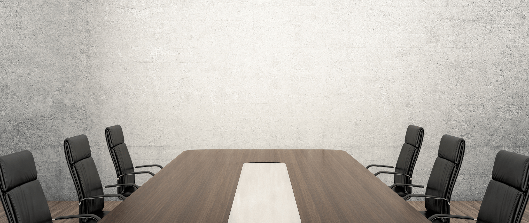 Une salle de rencontre avec une grande table en bois avec six chaises de bureau en cuir noir autour de la table